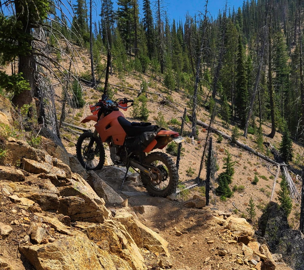 a motorcycle parked on a switchback 