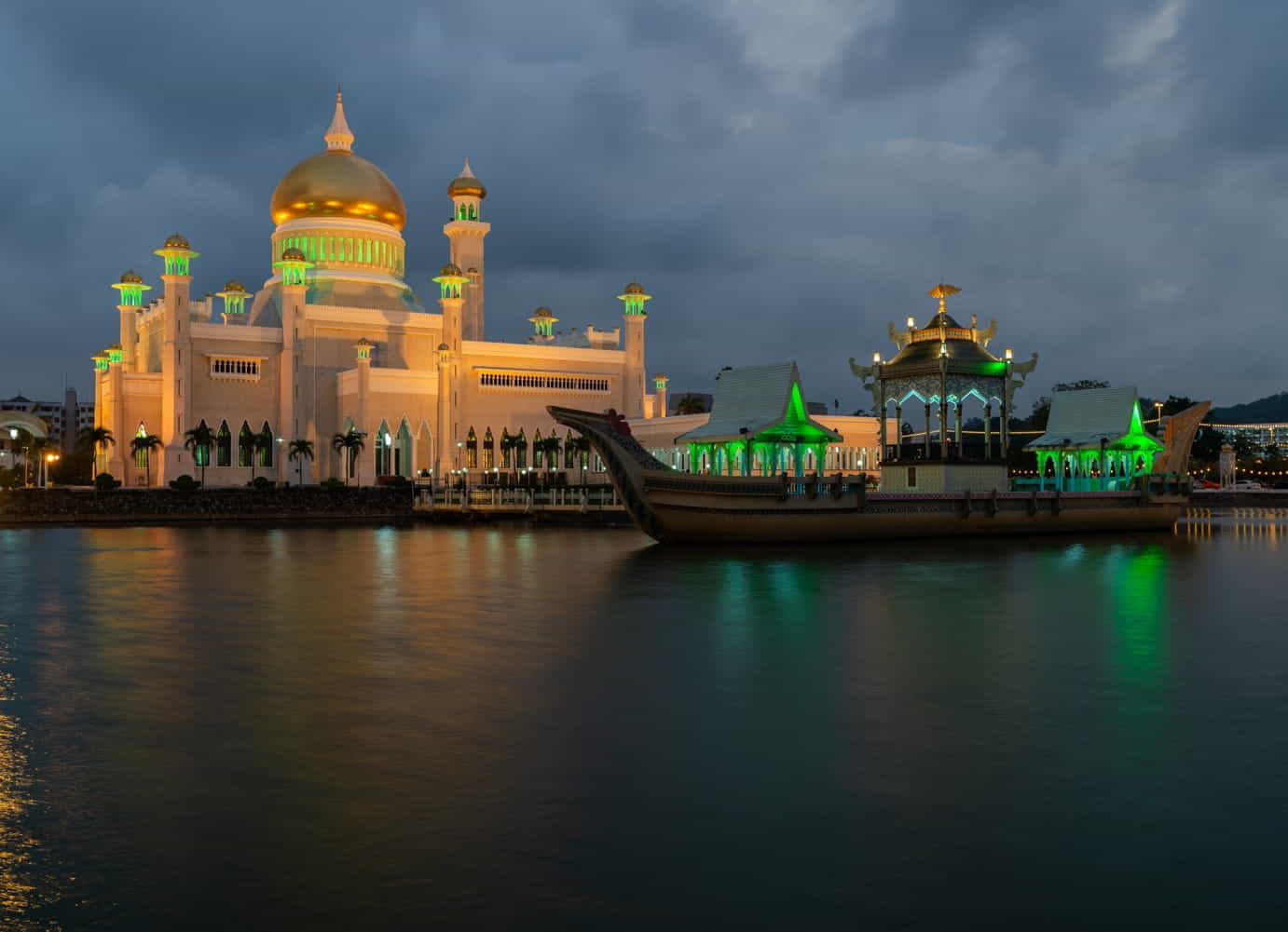 a mosque next to a pond