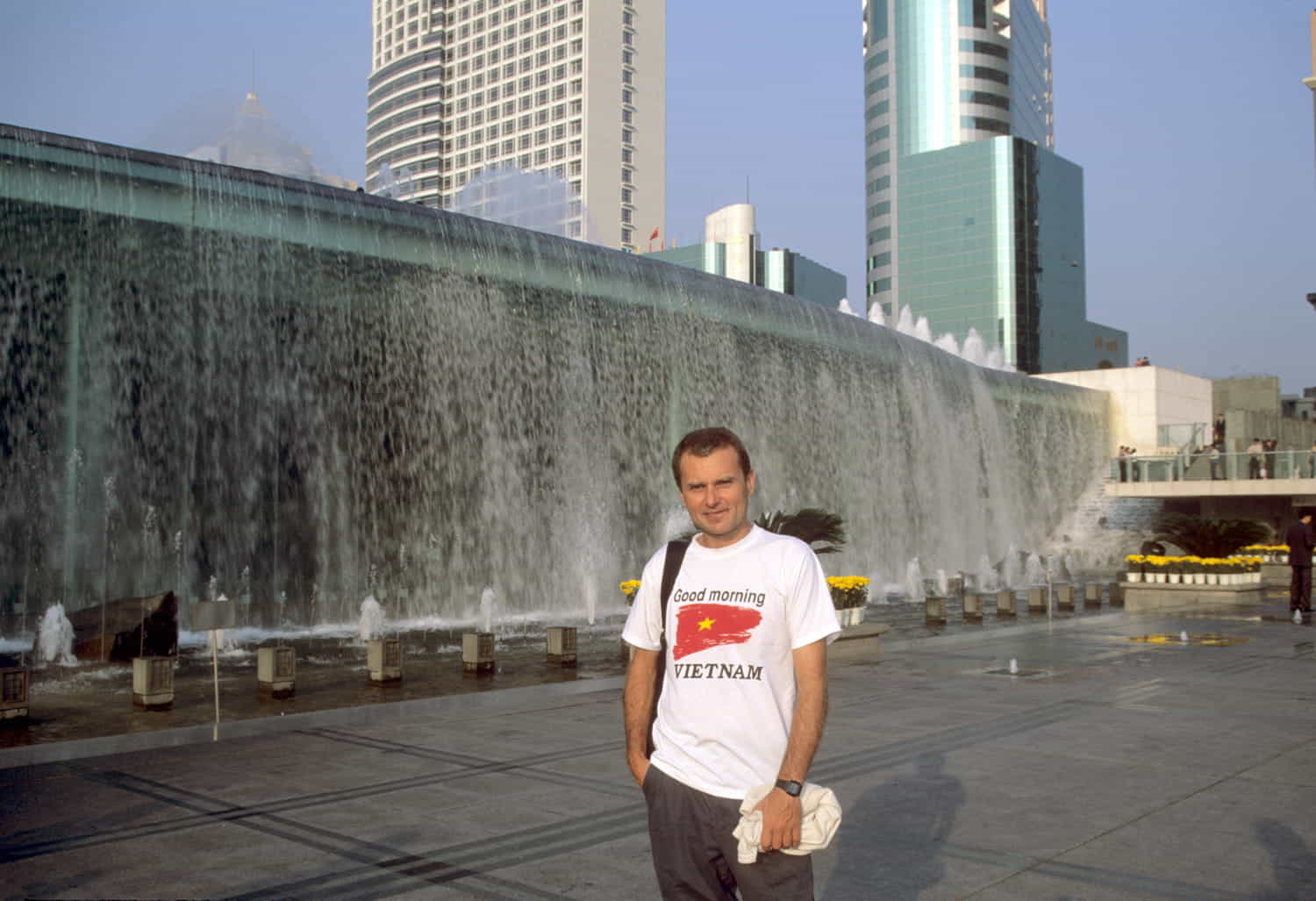 person in front of modern glass buildings