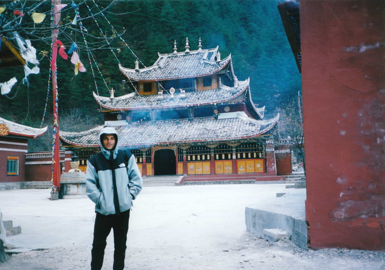 person posing in front of a Chinese temple