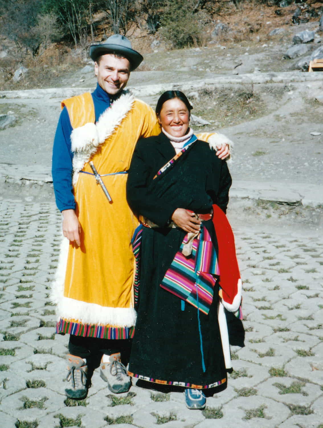 two people posing in traditional Tibetan clothes