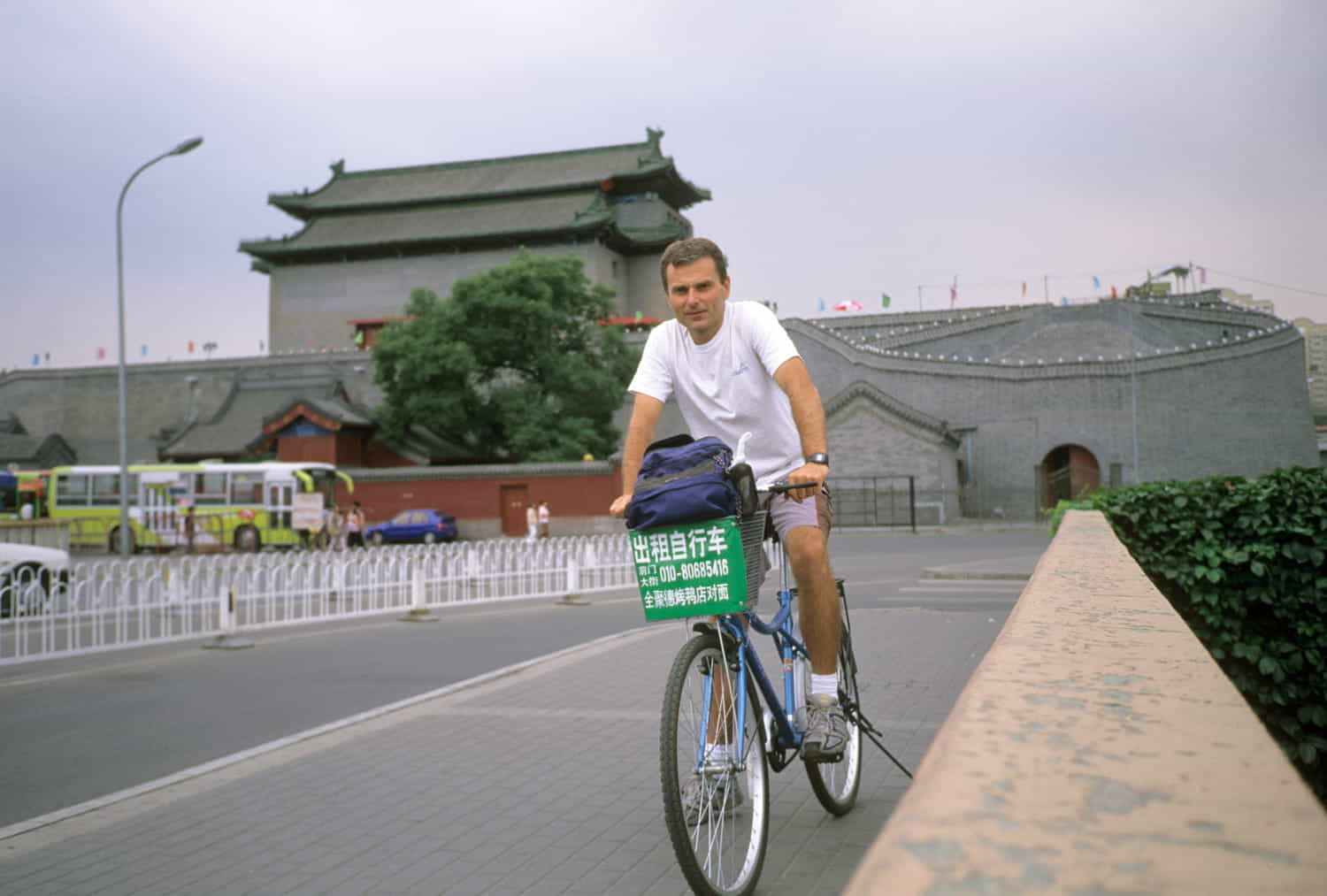 a bicycle rider with a temple behind