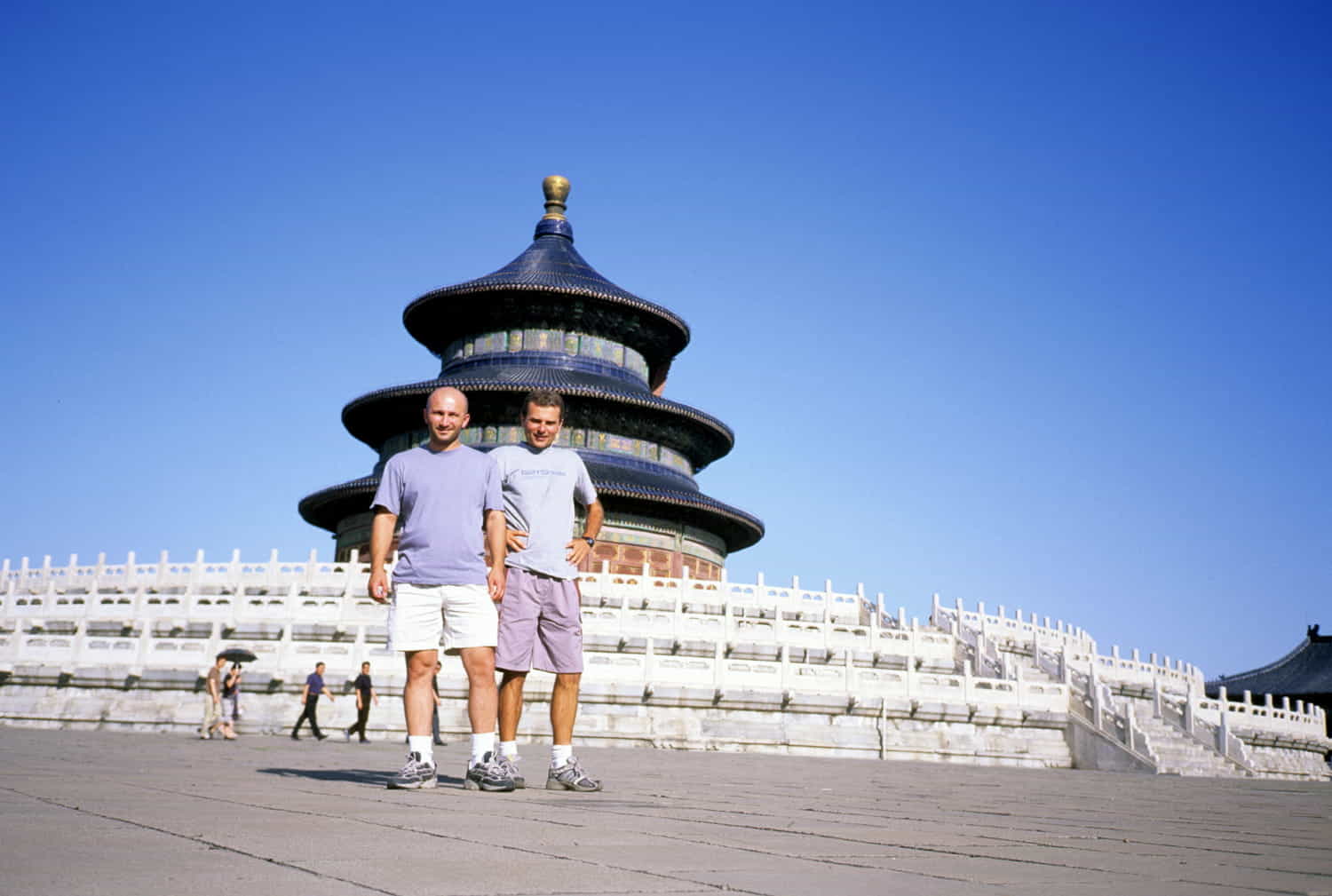 two guys in front of a round temple