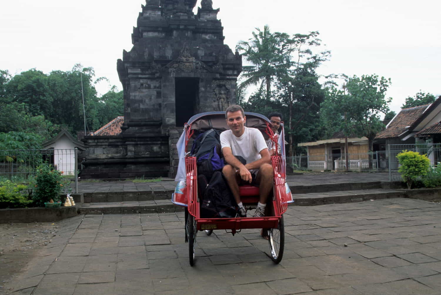 a person sitting in a richshaw