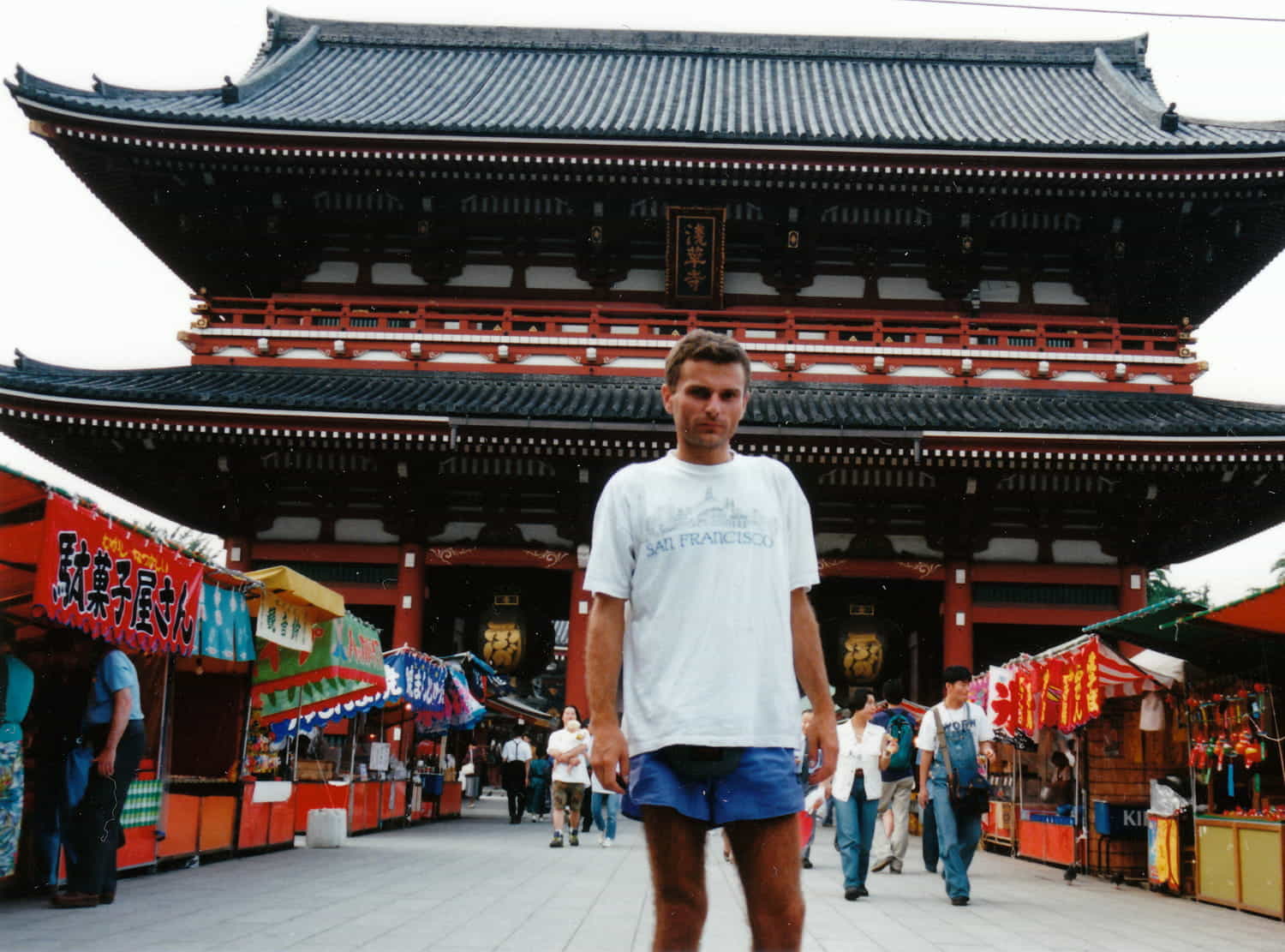 person on a path leading to a big temple