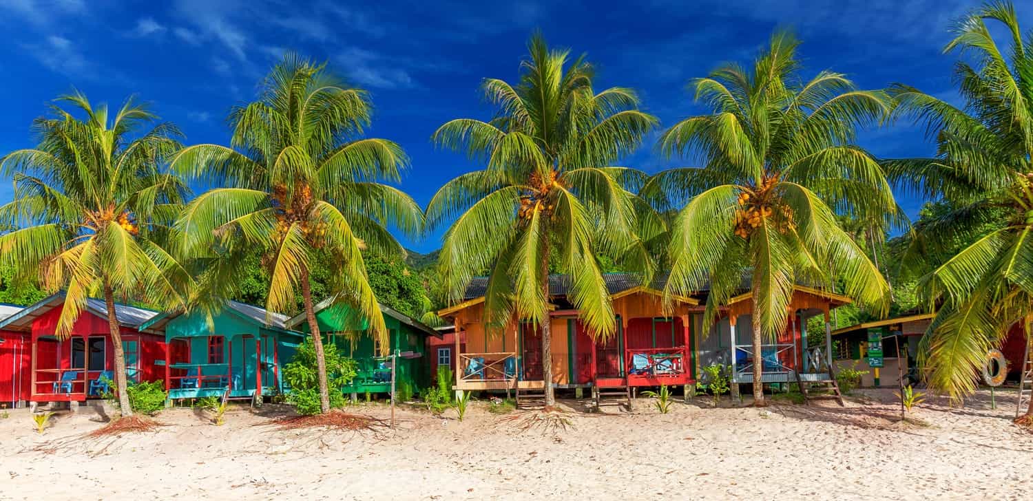 coklorful bungalows on a beach 