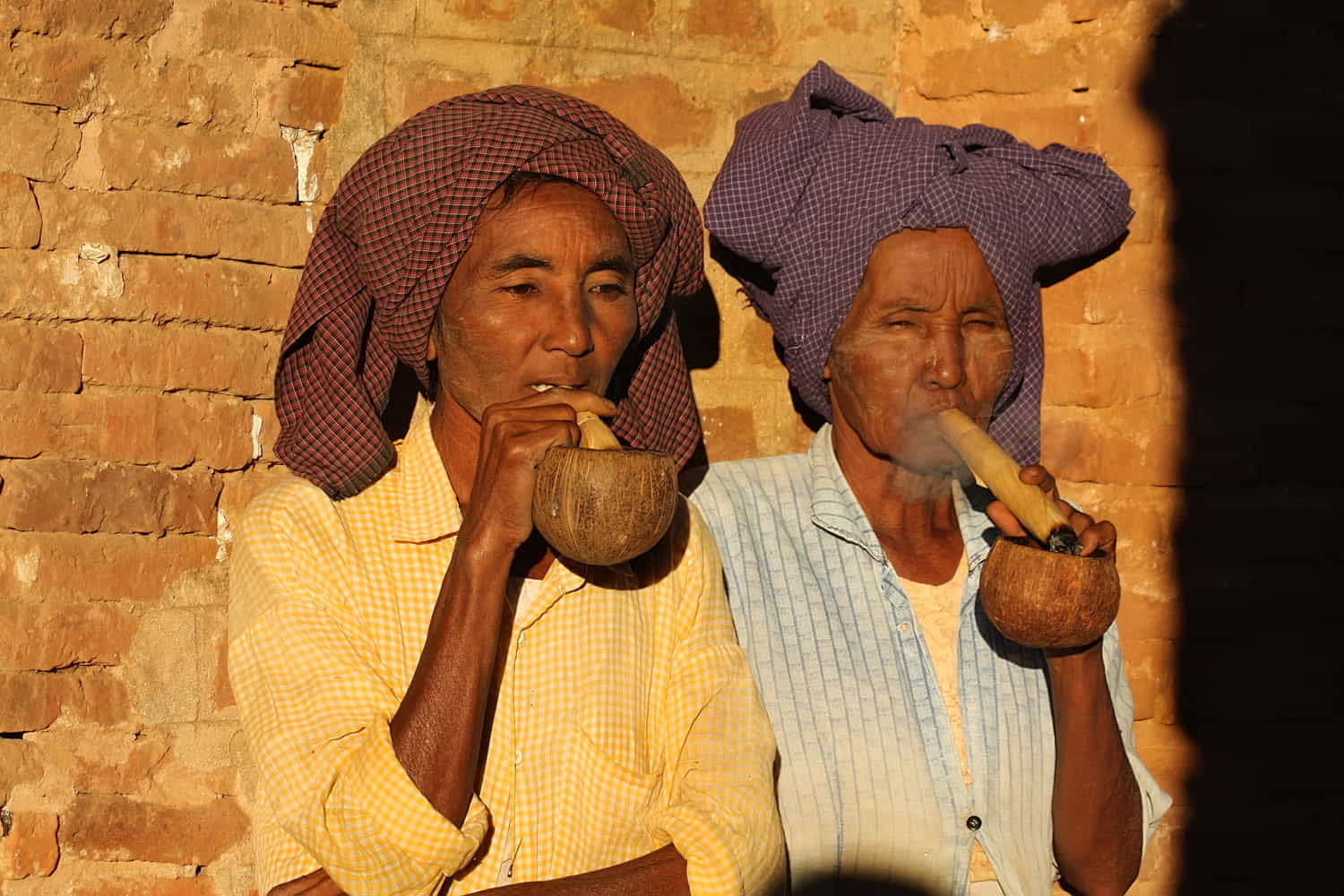 two ladies smoking cigars