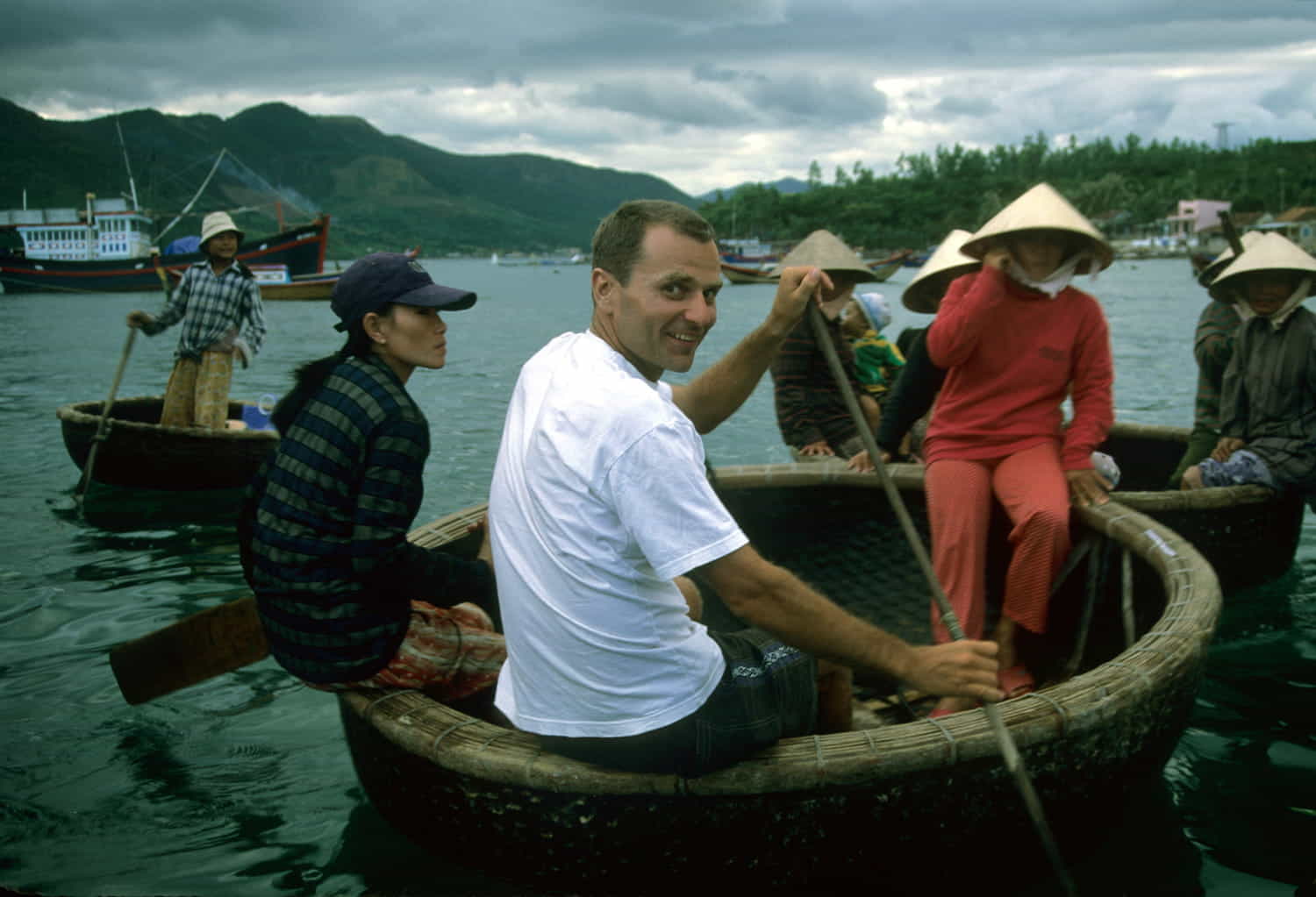  people in round boats paddling around