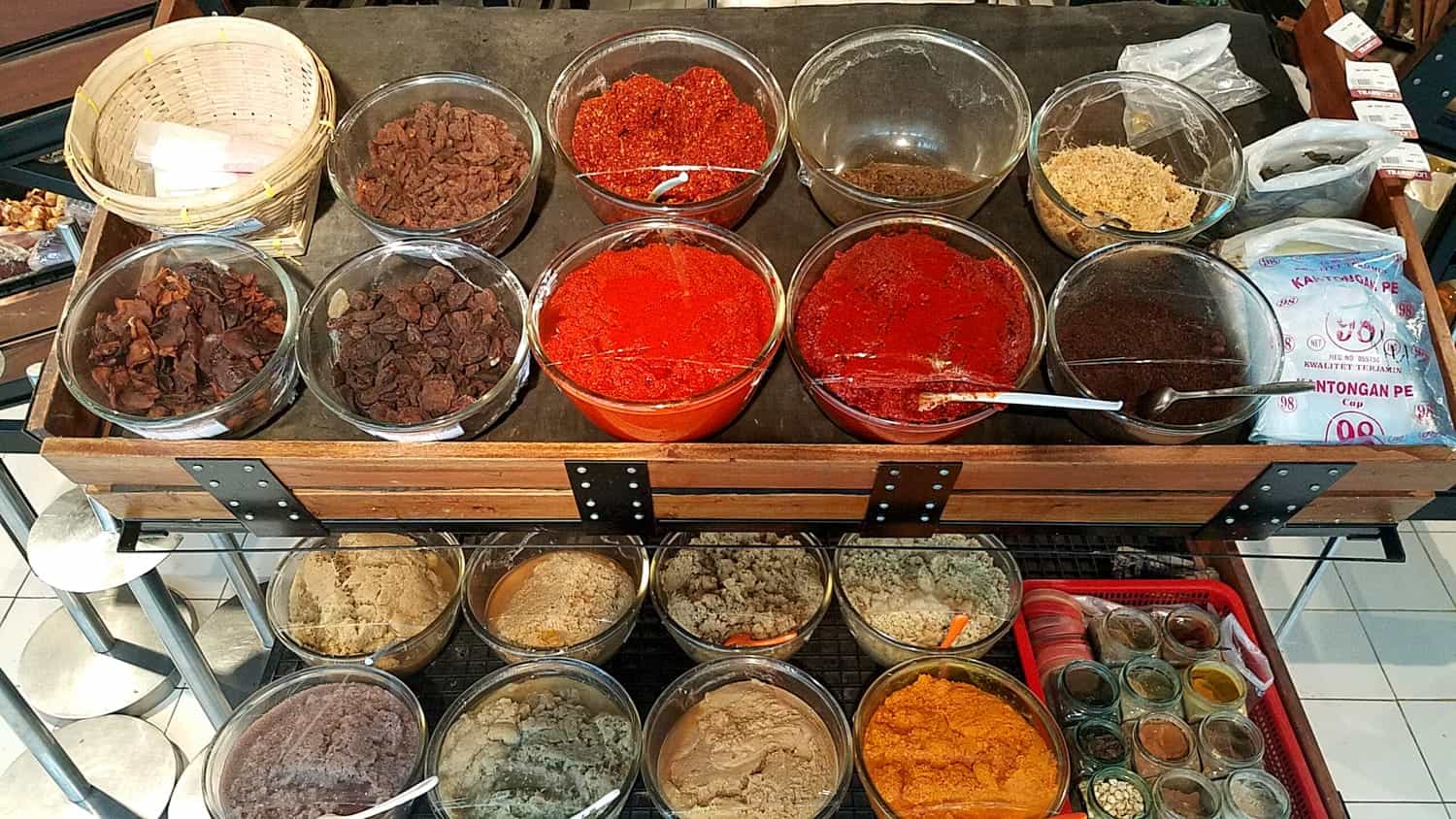 bowls with various curries and sauces 