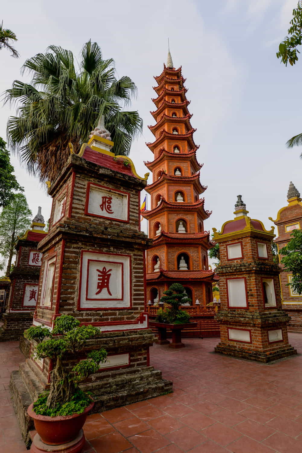 stupas and a tall skinny pagoda