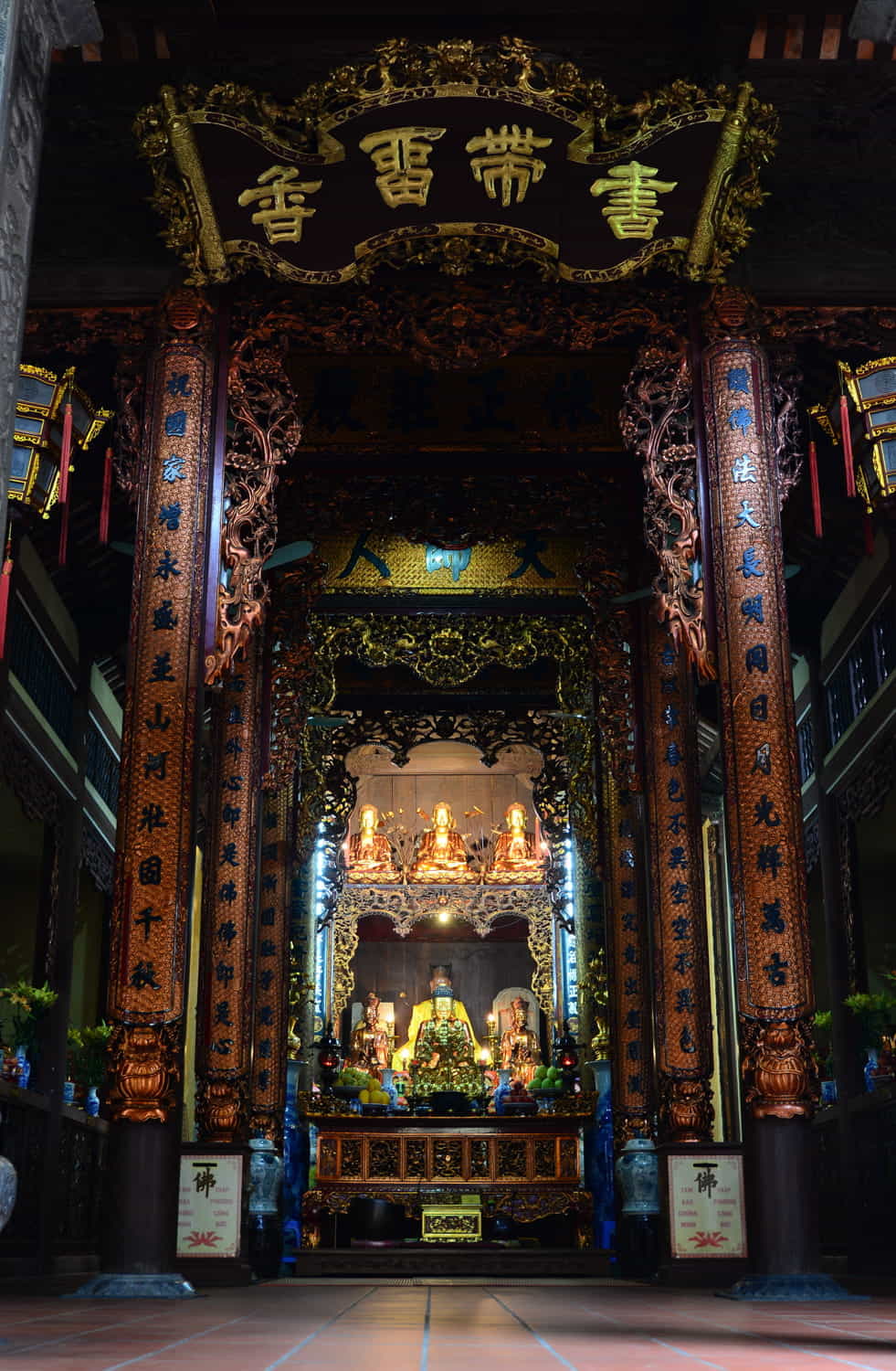 view of the inside of a Vietnamese temple with Chinese characters 