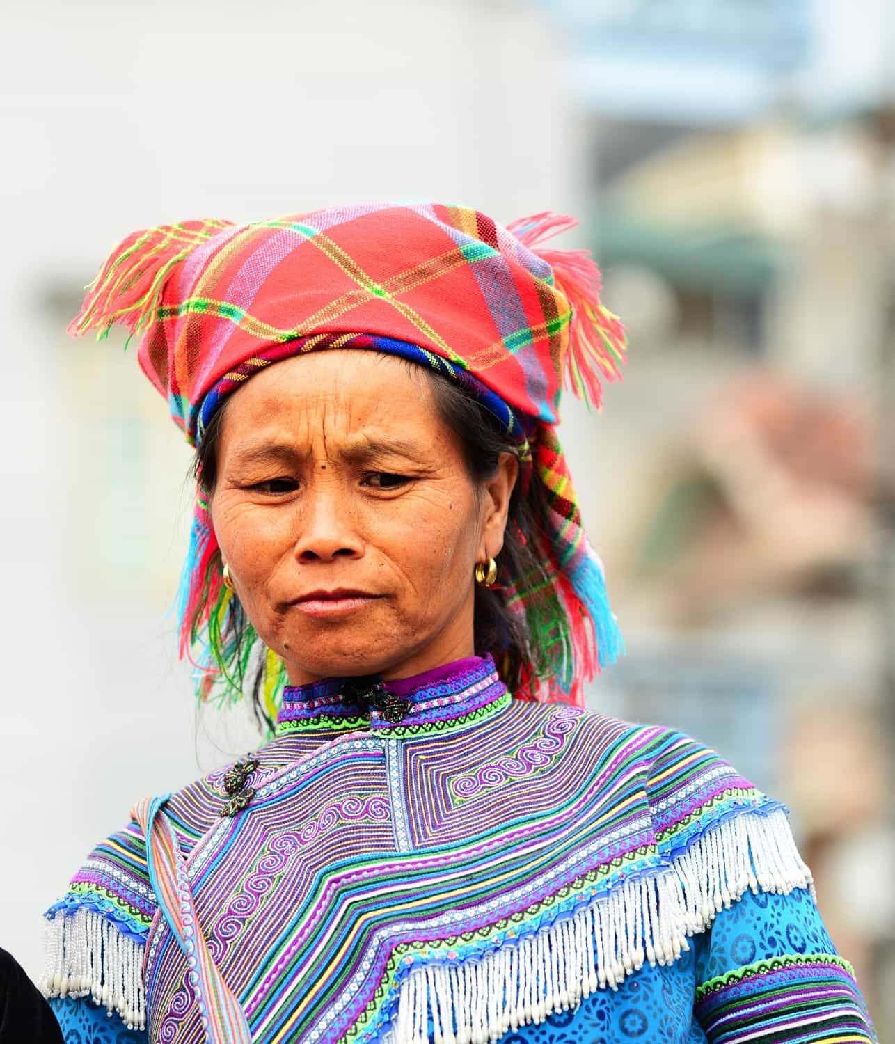 a lady with colorful clothes and headwear