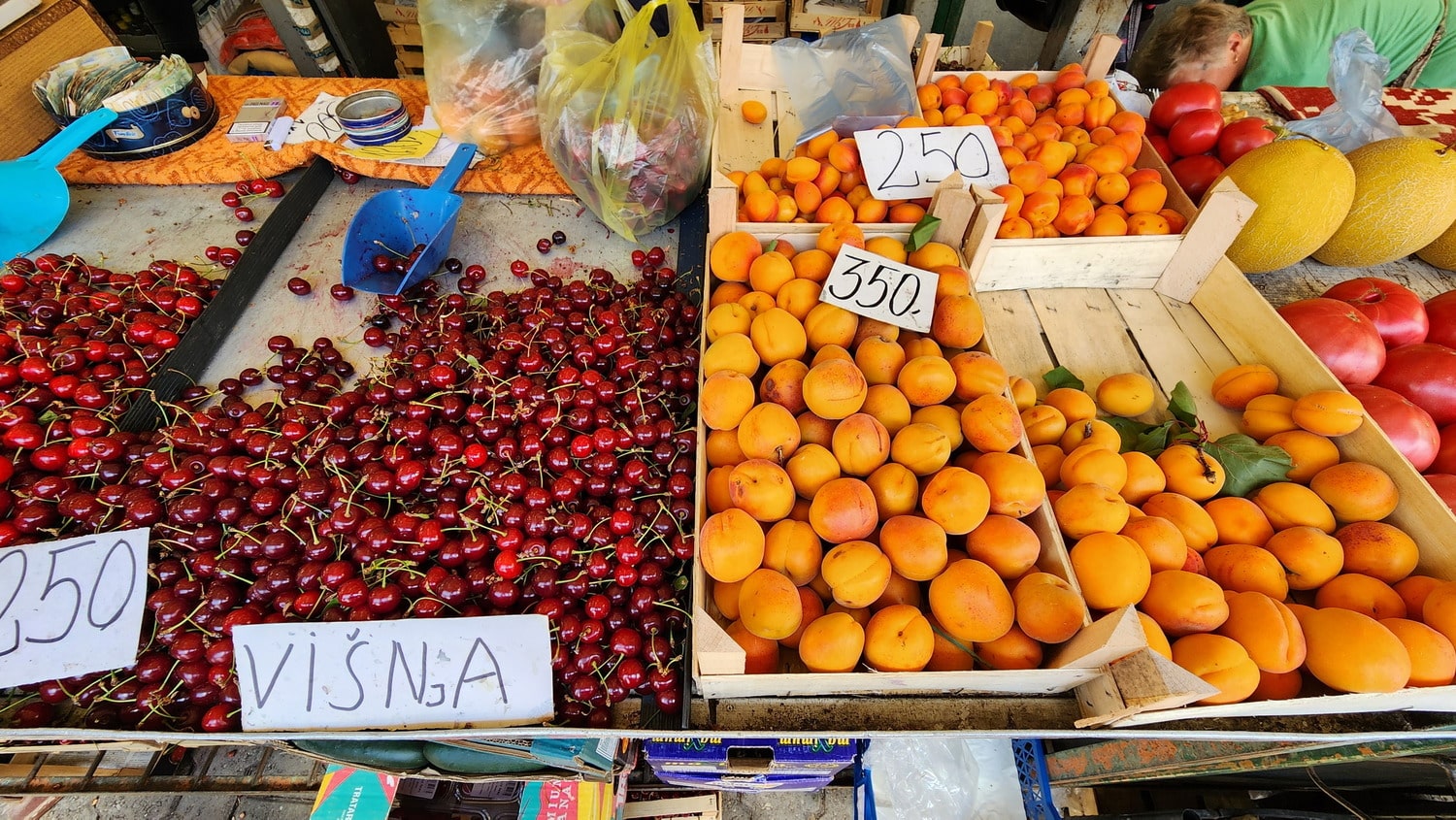 cherries and appricots for sale at a farmer's market