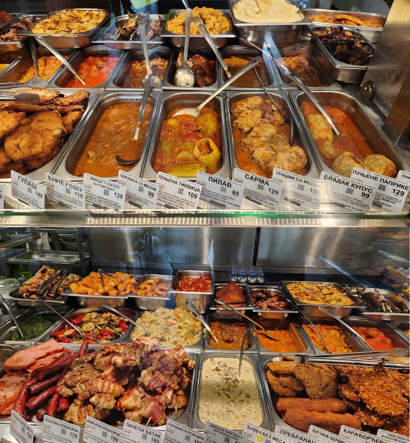 various pre-cooked dishes in a display