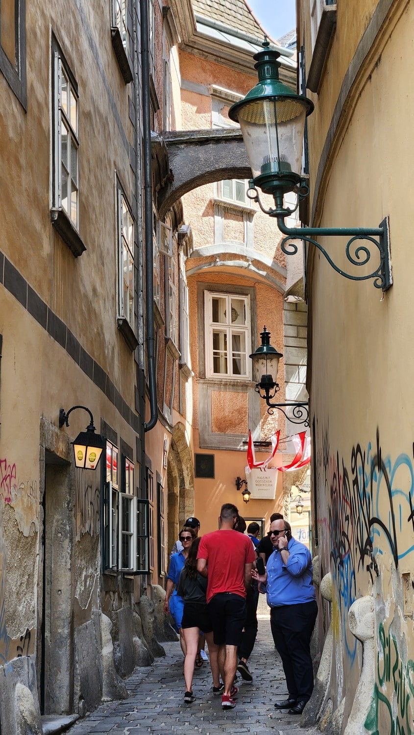 people in a narrow alley