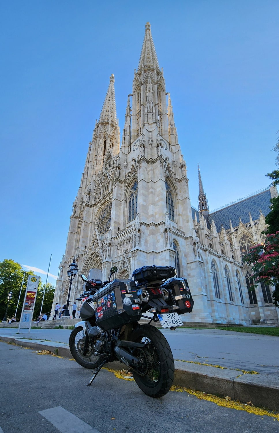 motorcycles in front of a cathedral