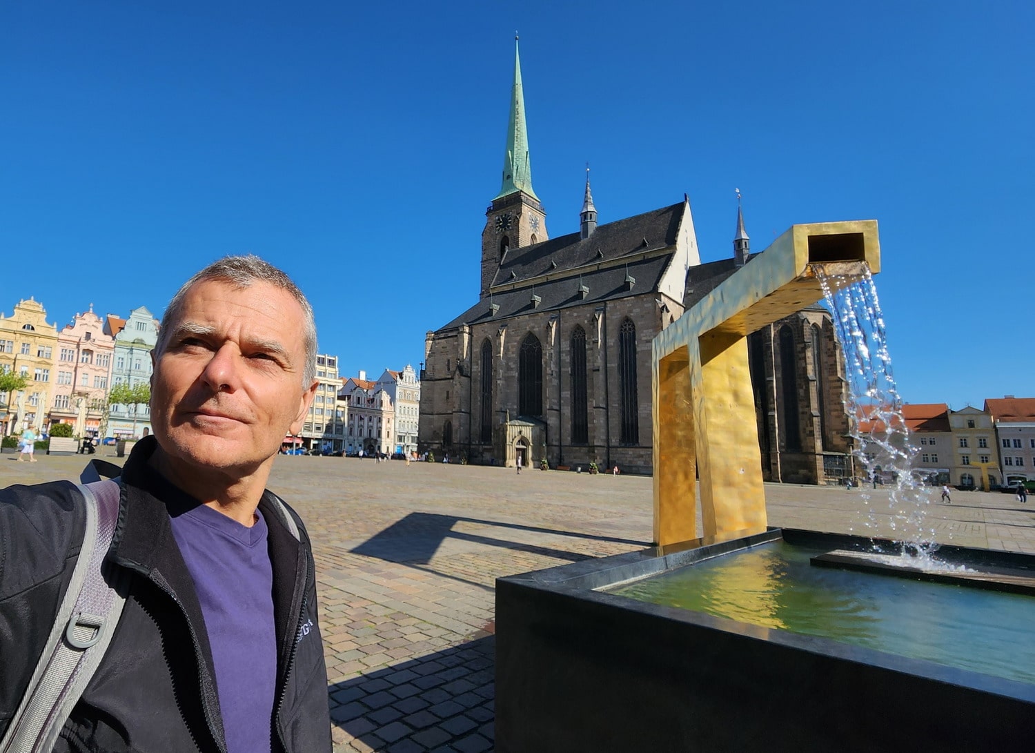 selfie on a big square with a cathedral behind