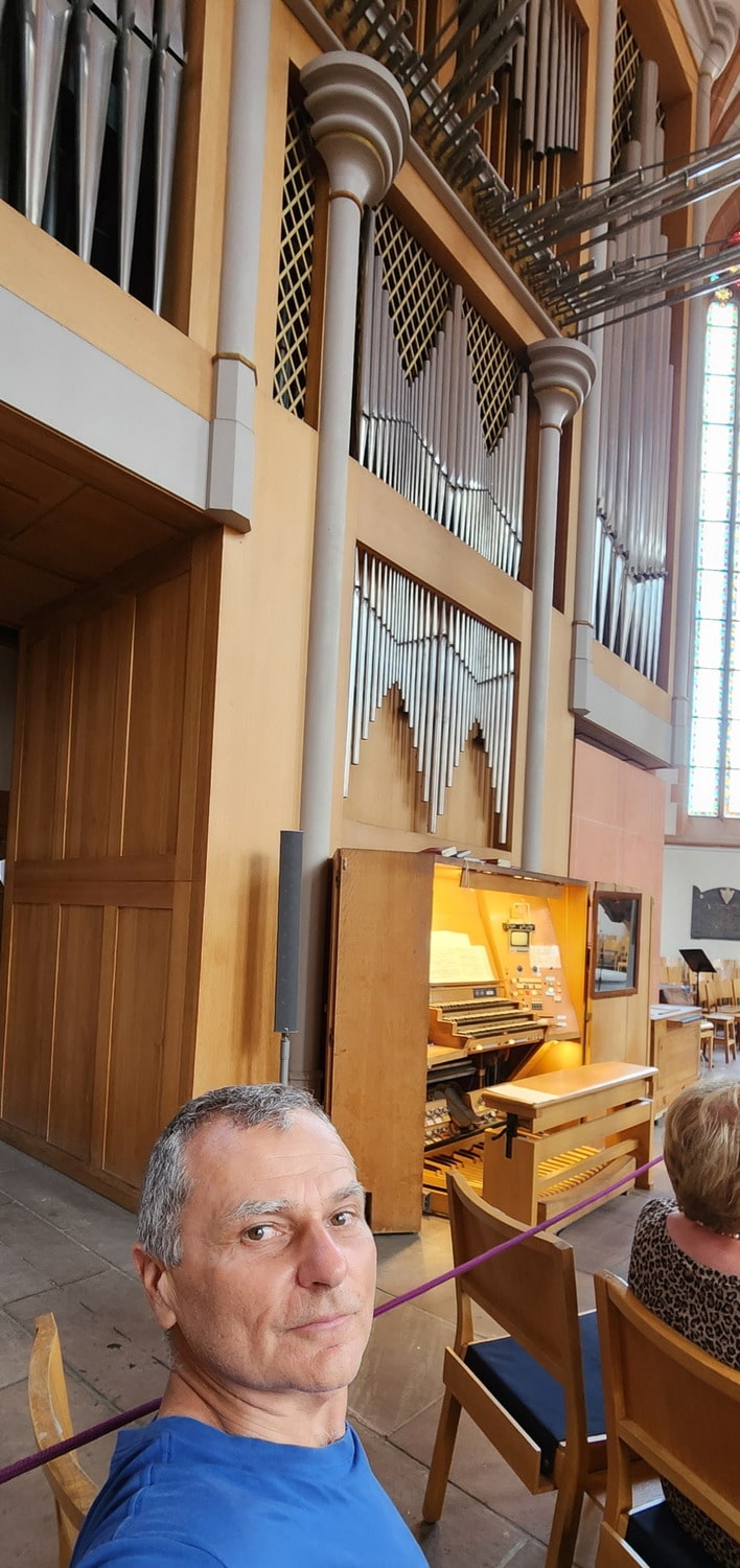 selfie next to organs in a cathedral