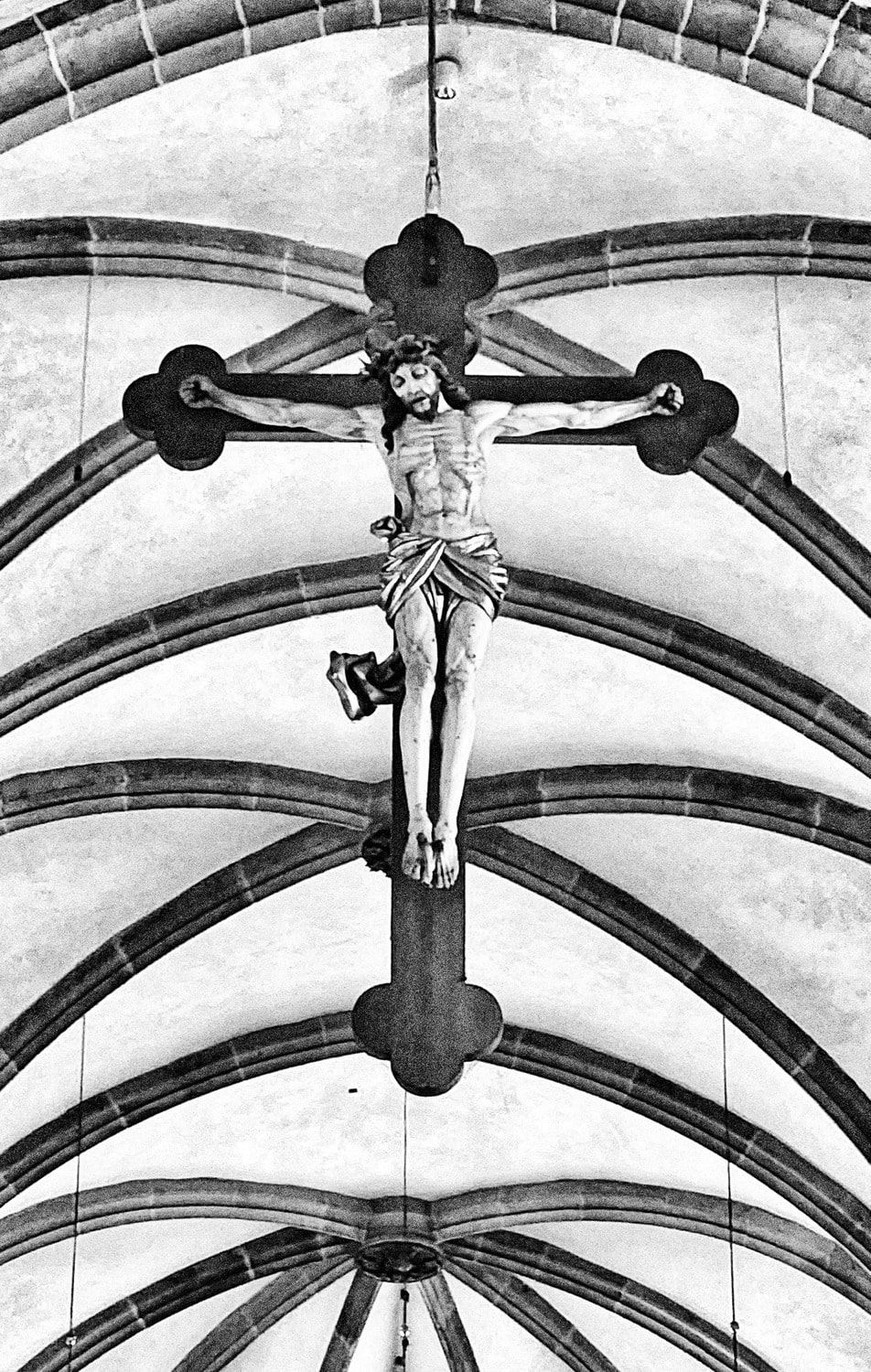 Jesus suspended on a cross in a cathedral