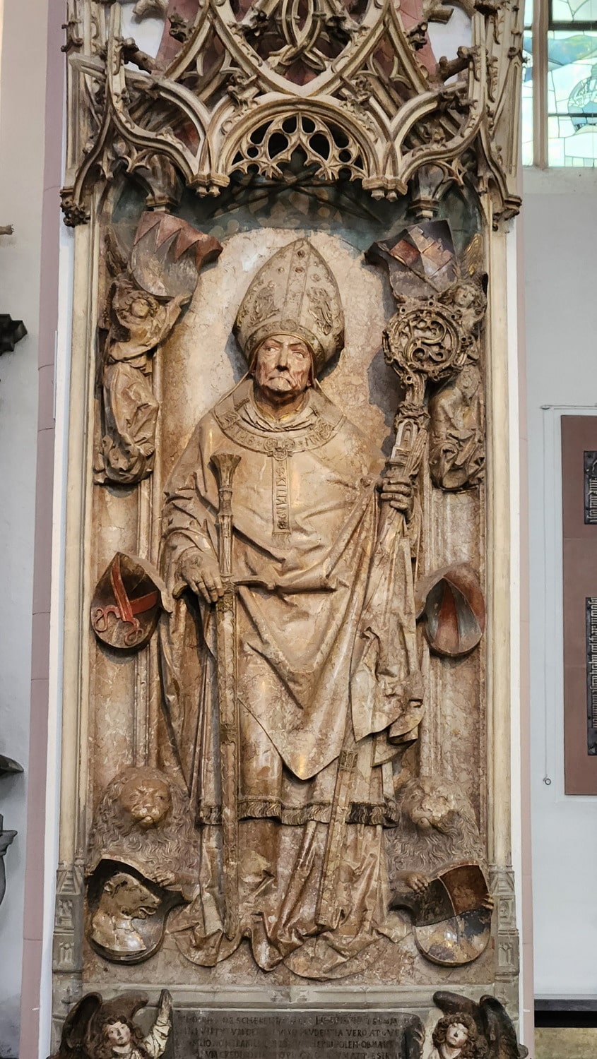 stone engraving of a saint in a cathedral in Germany