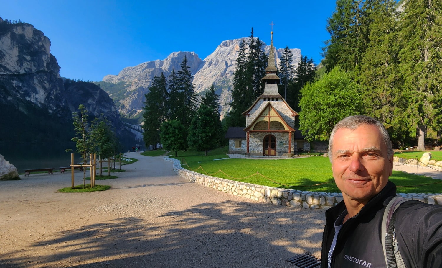 selfie next to a small chapel