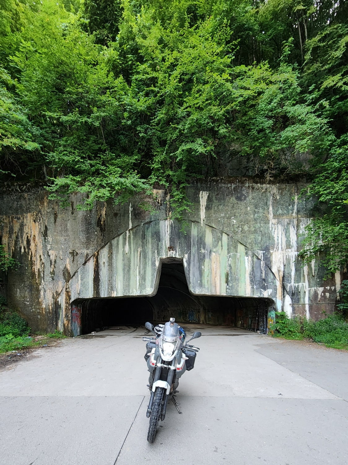 motorcycle in front of a bunker entrance 