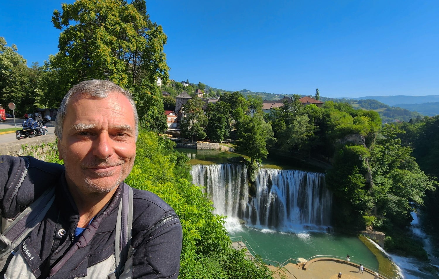 selfie next to a waterfall