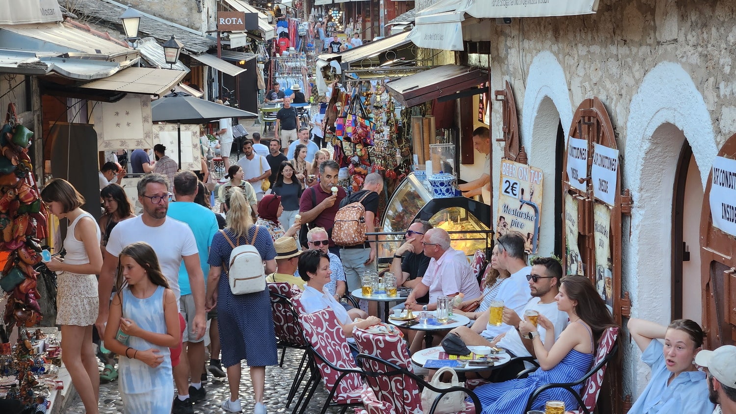 crowded narrow alley with cafes and suvernier shops