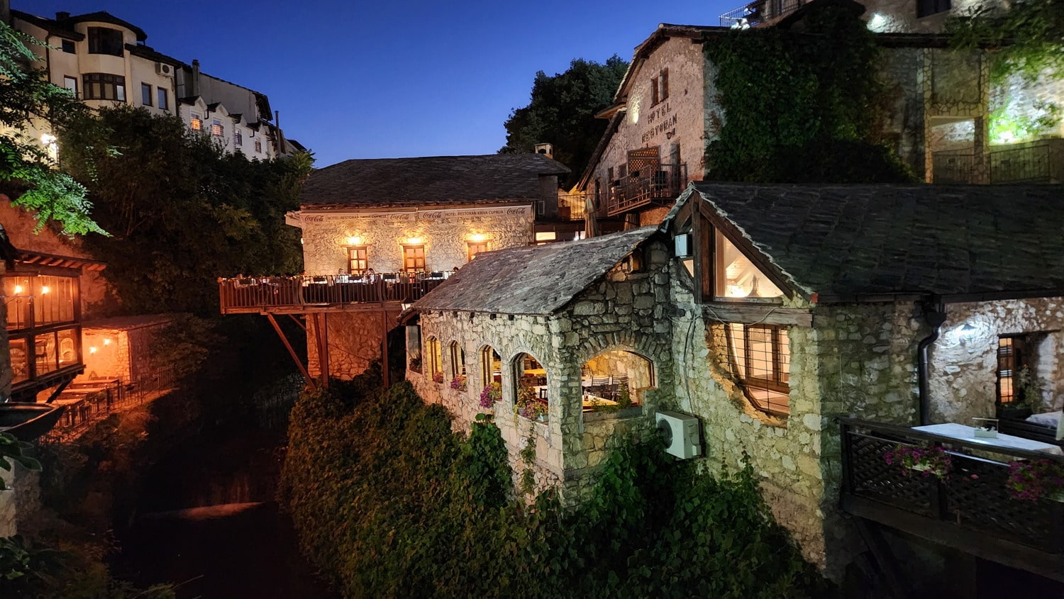 stone houses on sides of a canyon