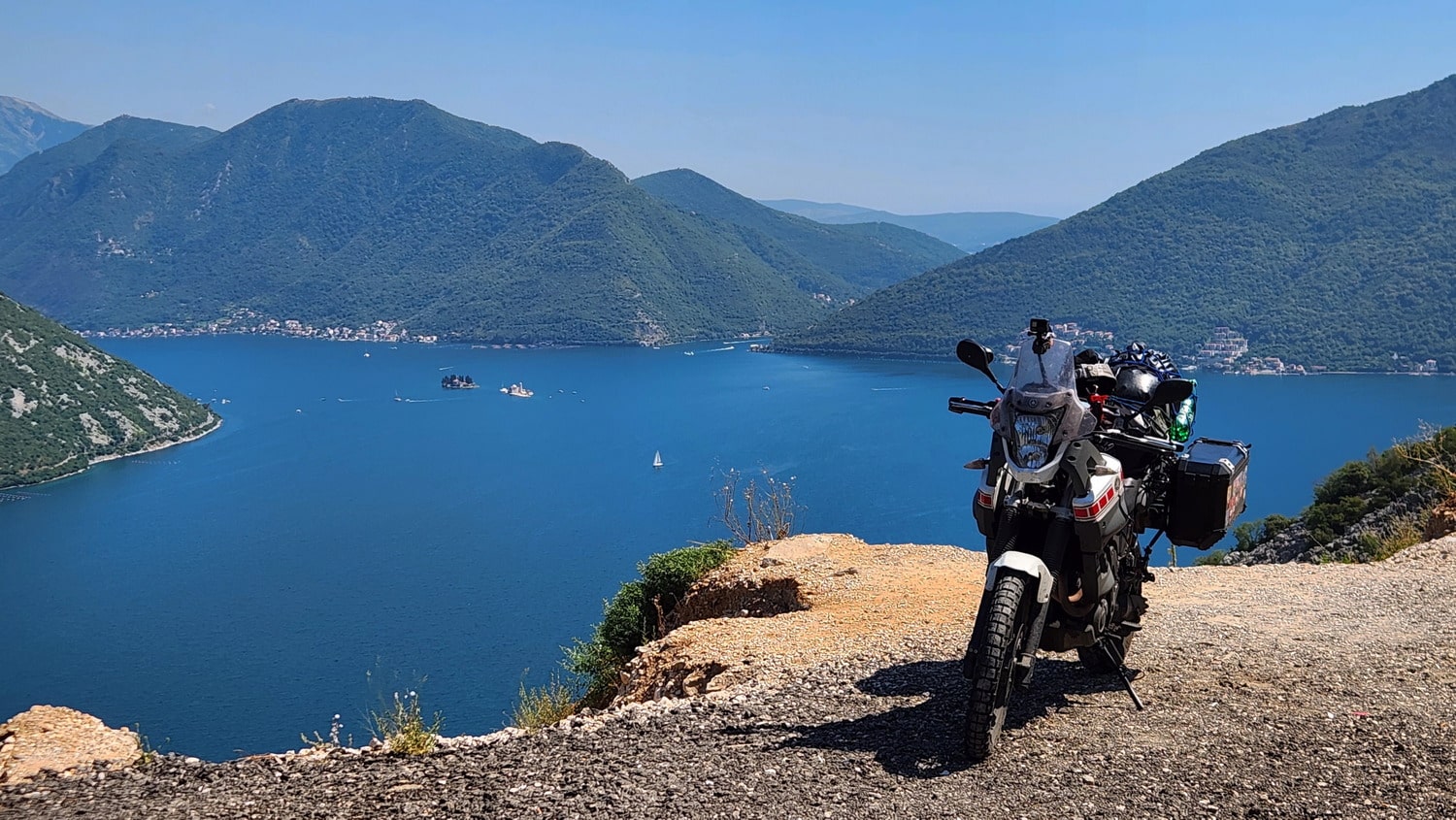 view of a bay with motorcycle in front