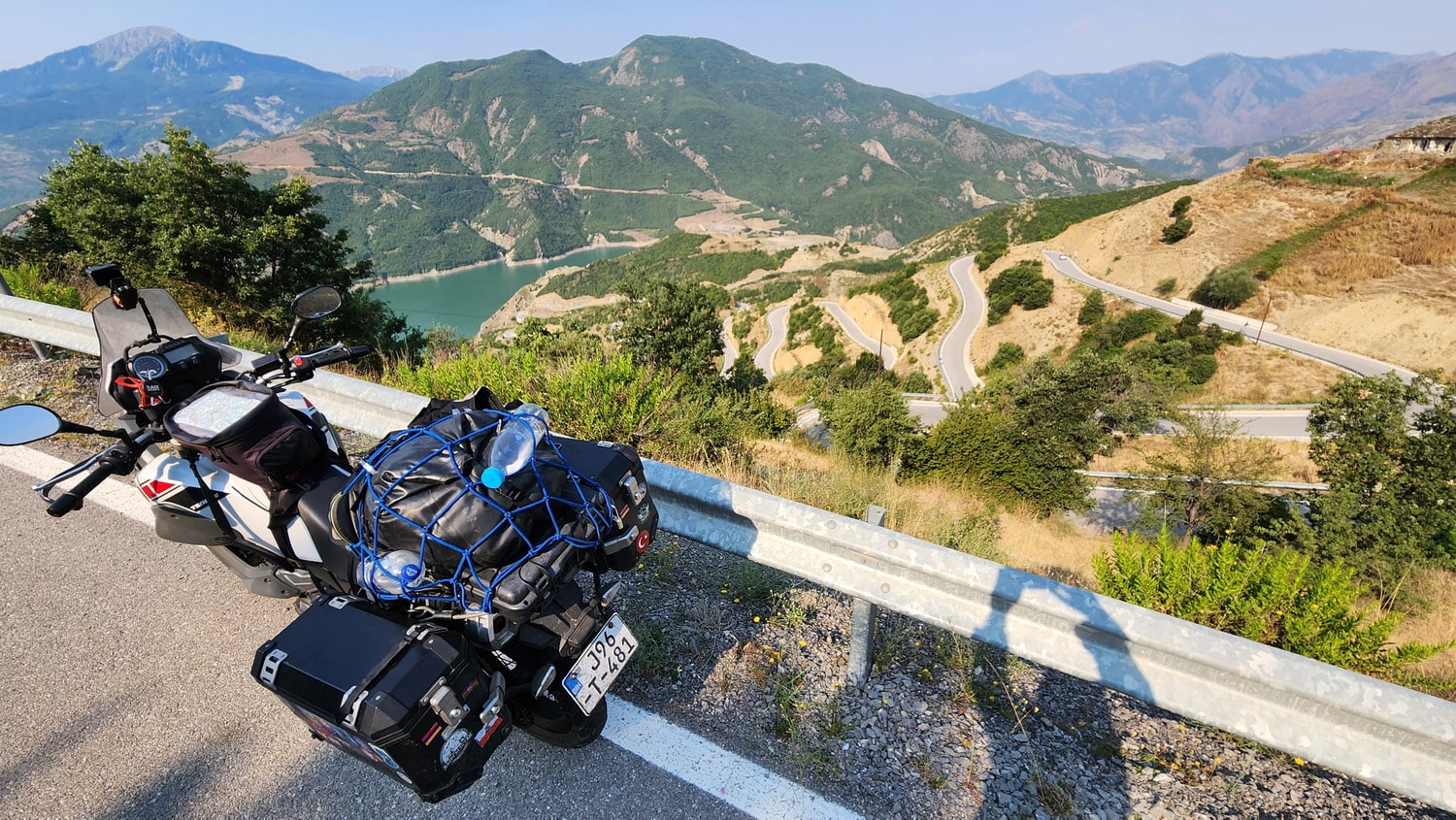 motorcycle in the moutains and switchbacks behind