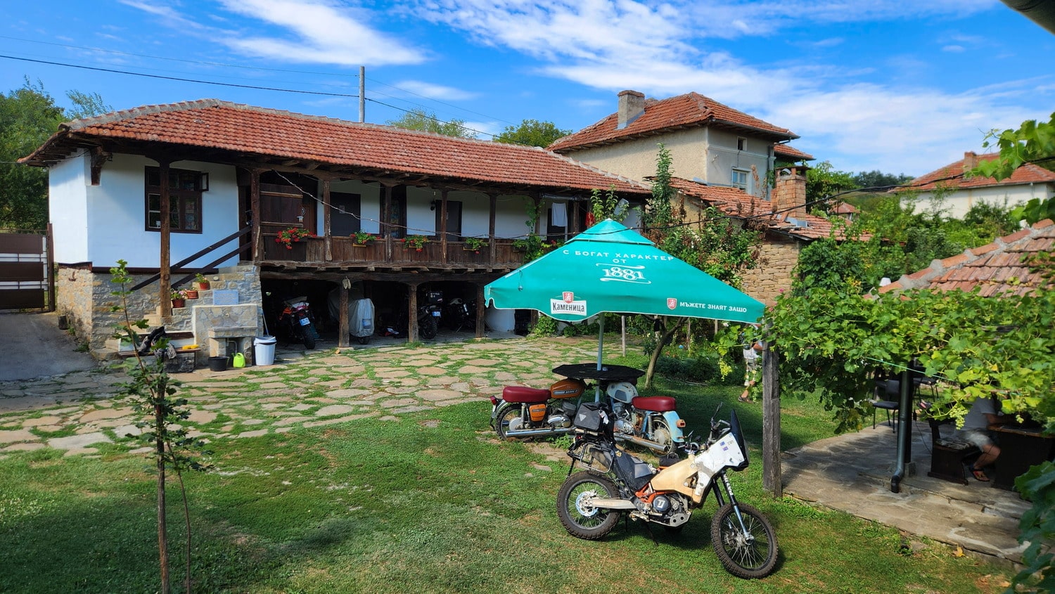 old house and bar stand made of old motorcycles