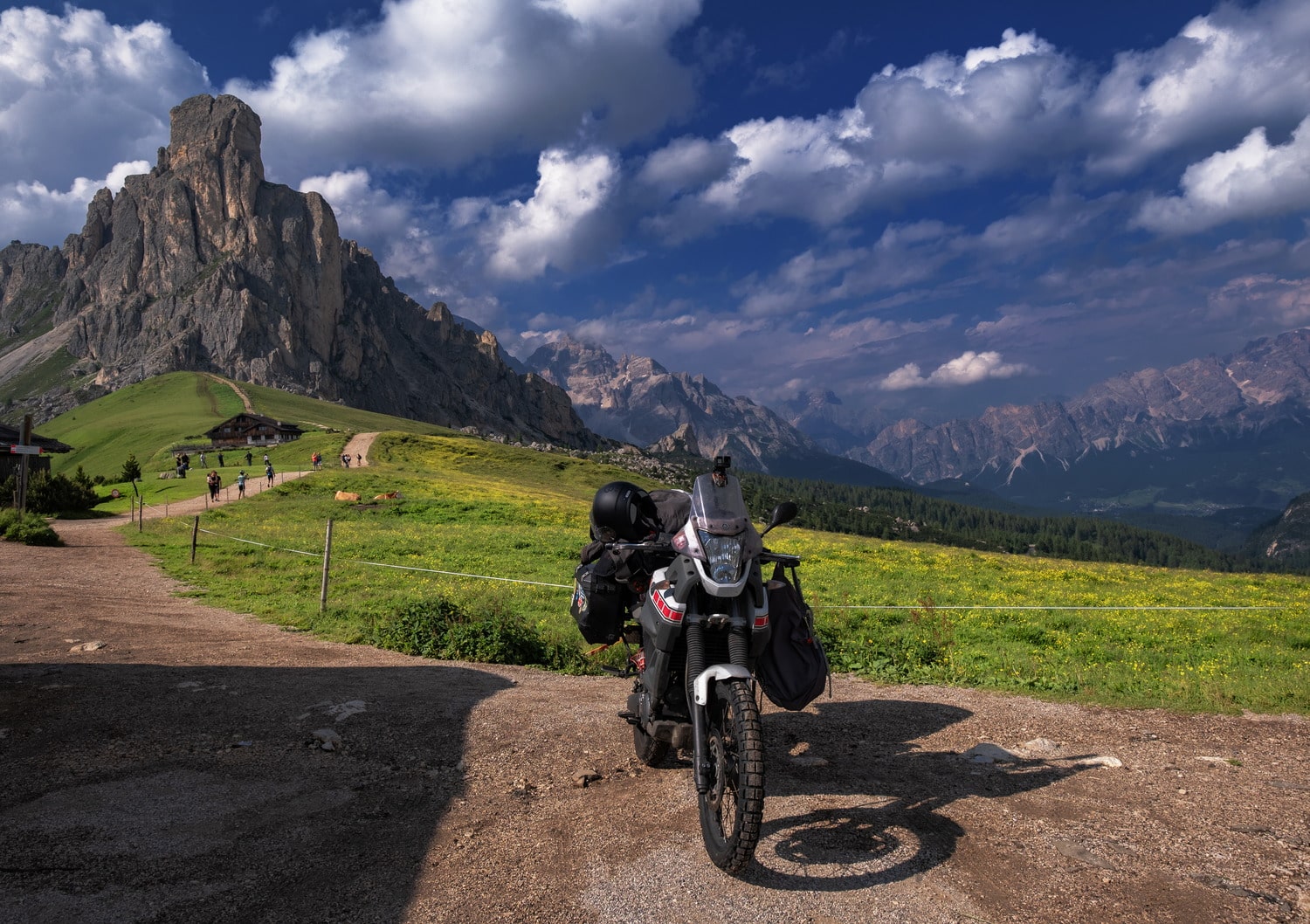 motorcycle parked with craggy peak behind