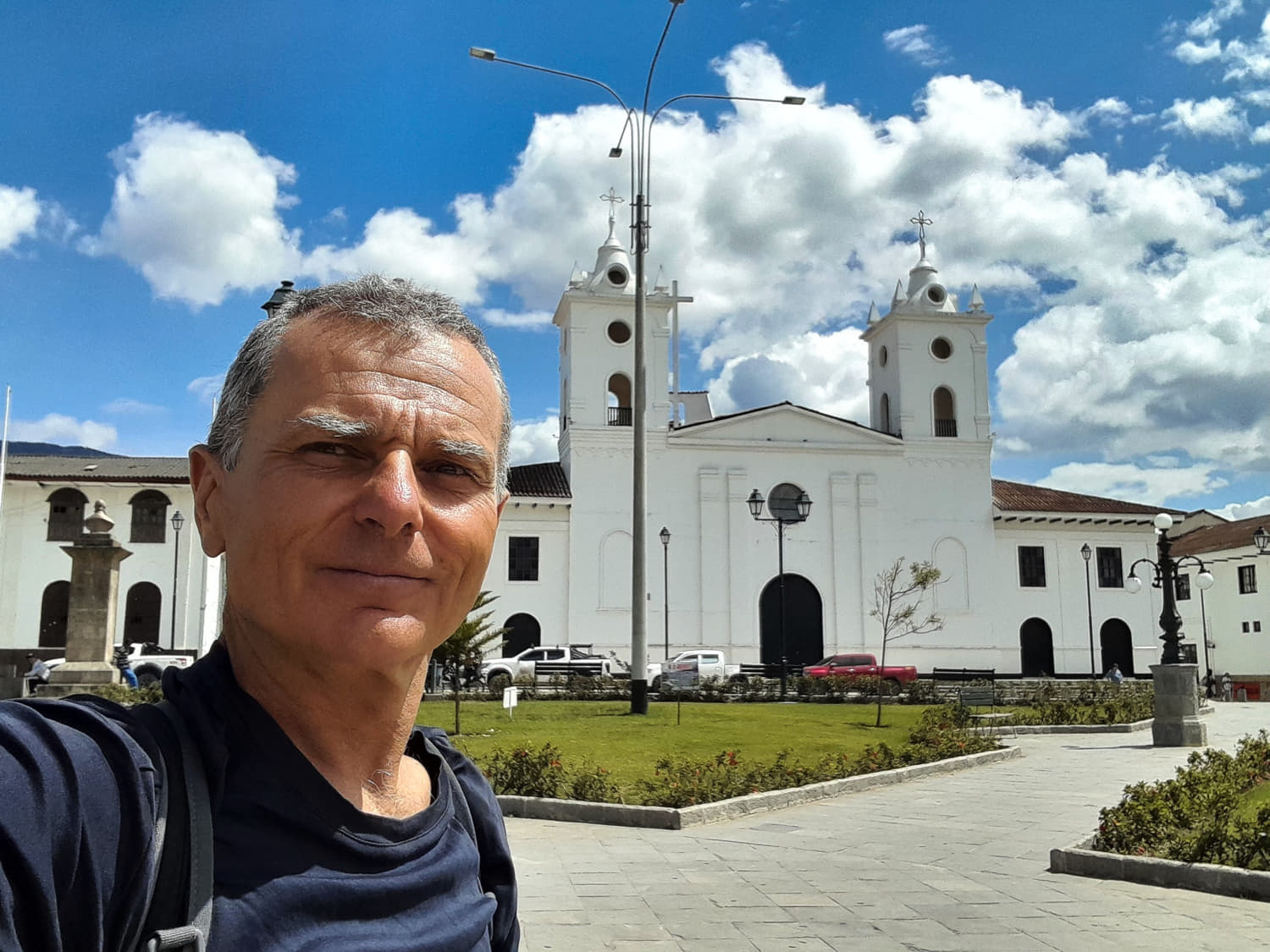 selfie on a big plaza with white church behind