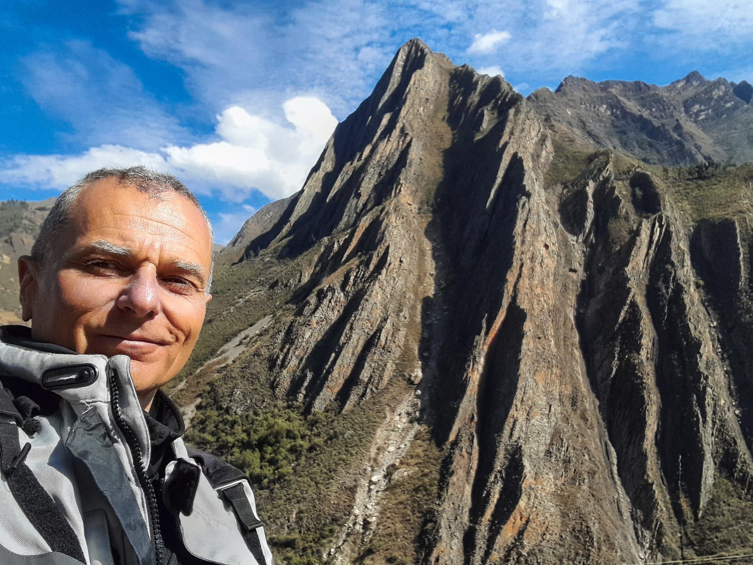 selfie with rock faces behind