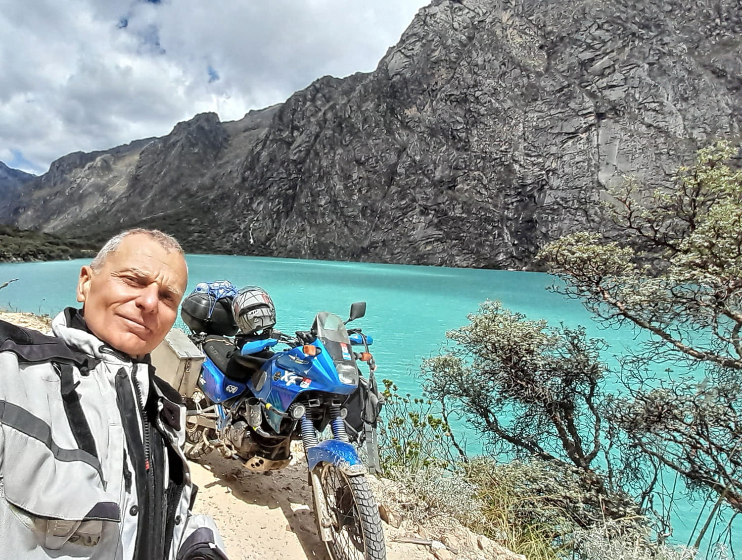 selfie next to a blue lake