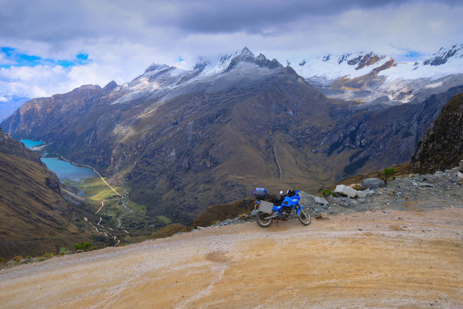 motorcycle with two blue lakes way down below