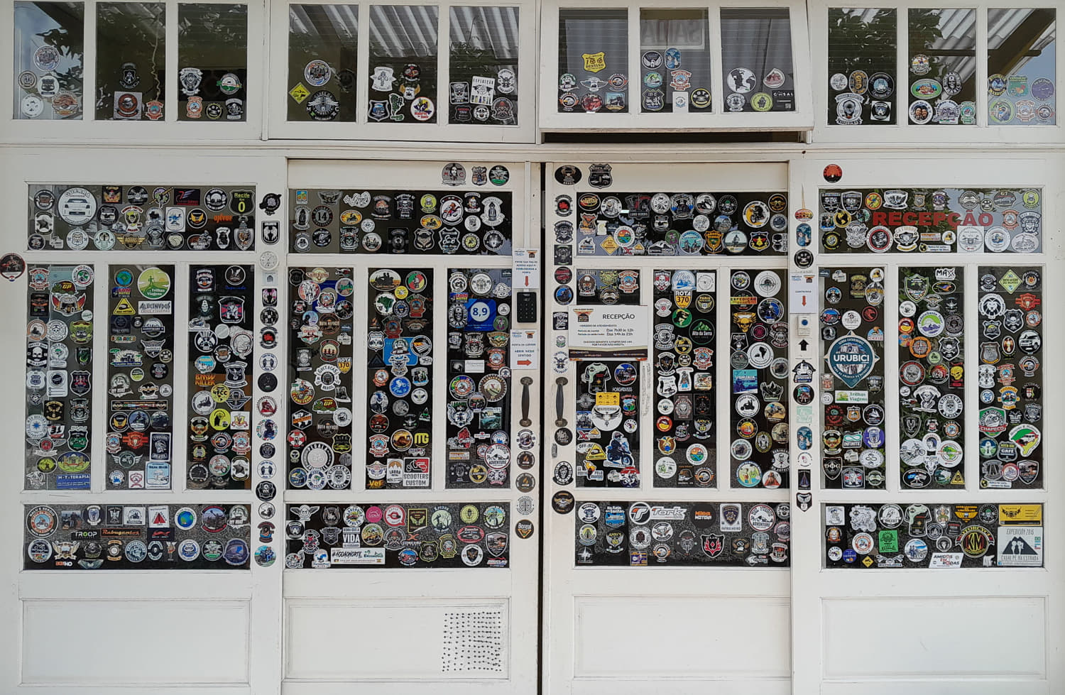 store front door and windows covered with stickers