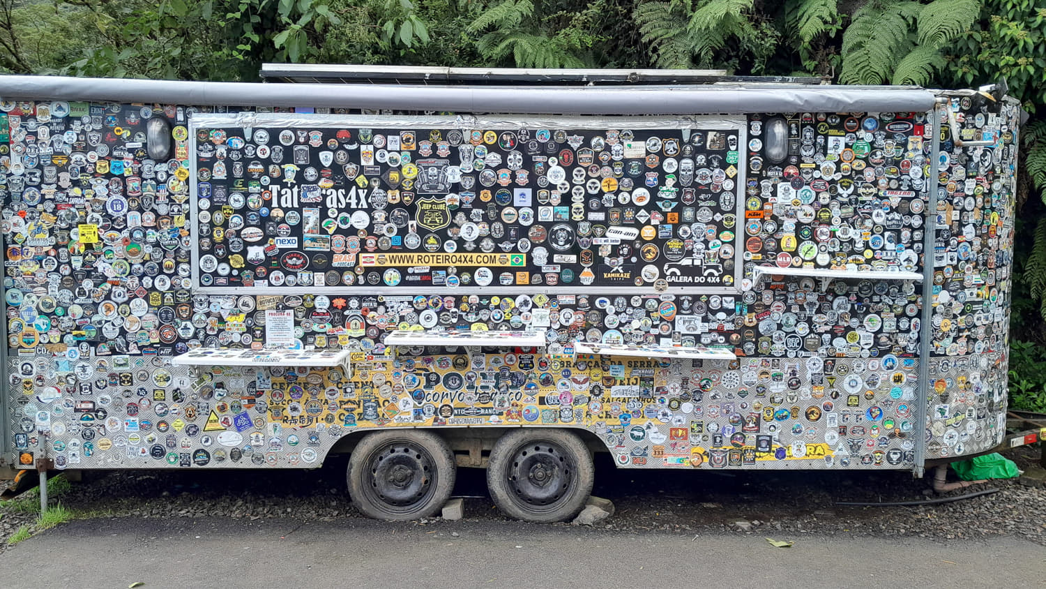 a food trailed covered with stickers