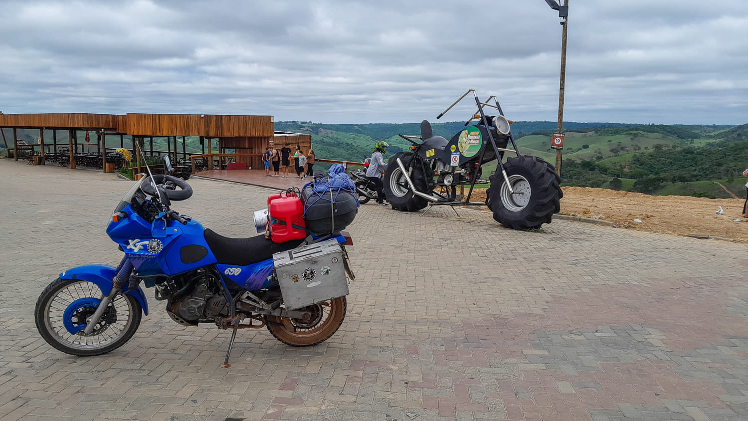 a motorcycle and motorcycle sculpture behind