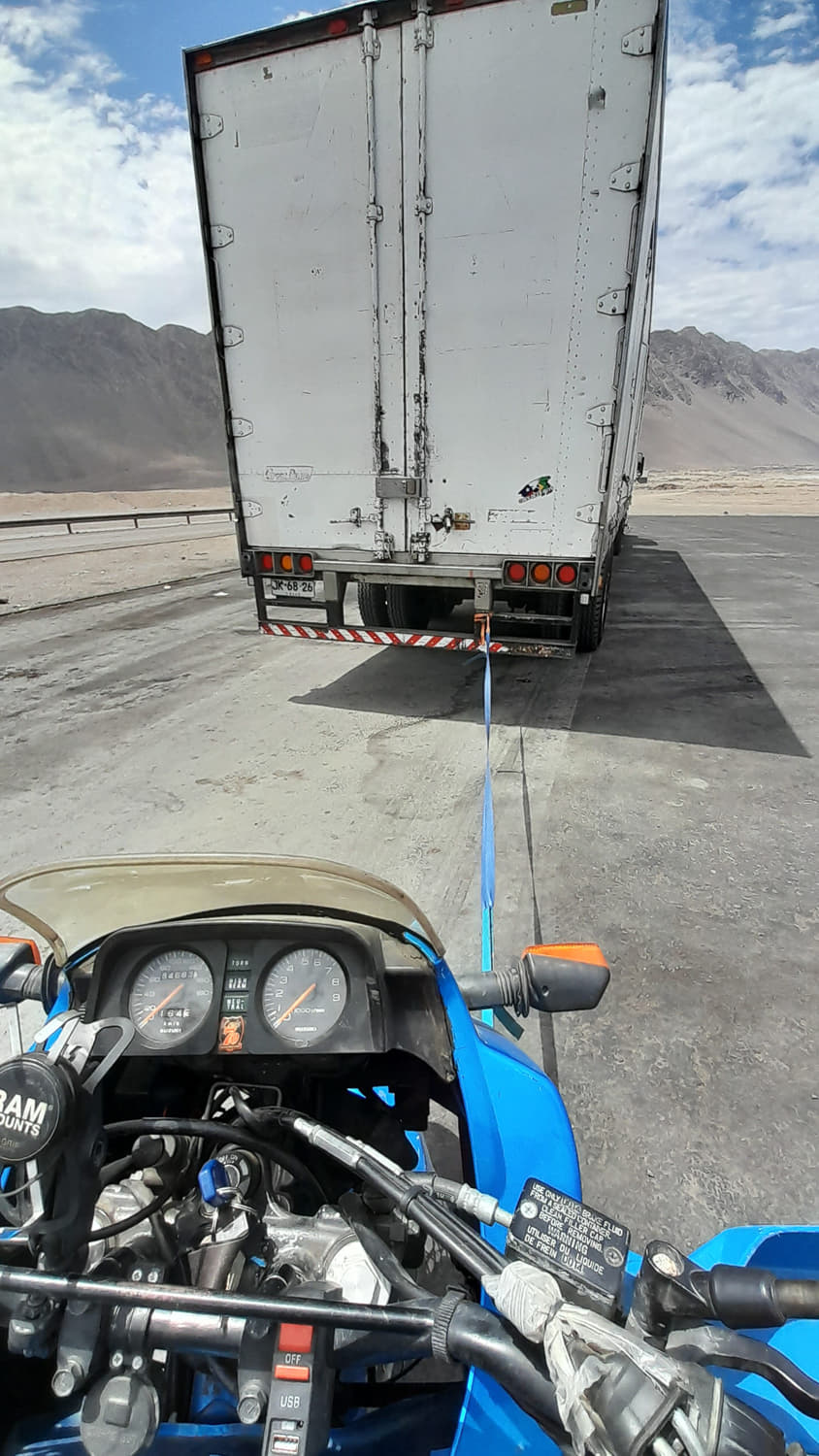 motorcycle towed by a semitruck