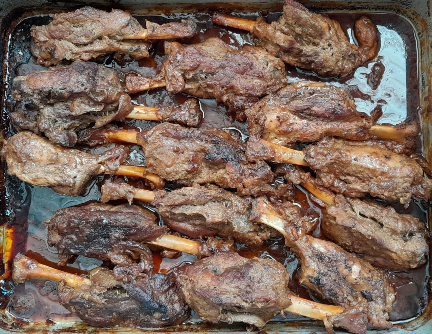 a tray filled with baked pork