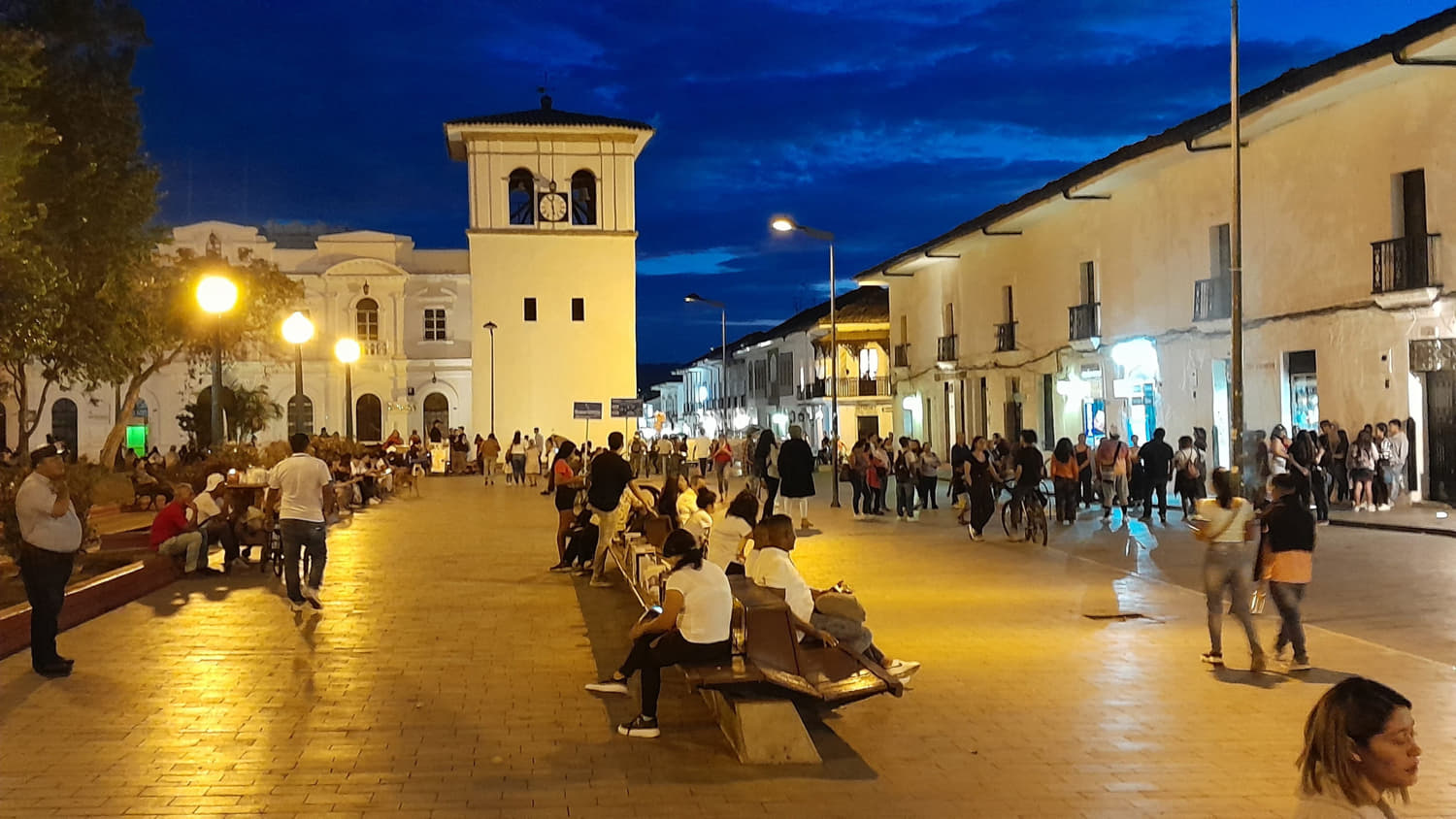 a crowded street at dusk