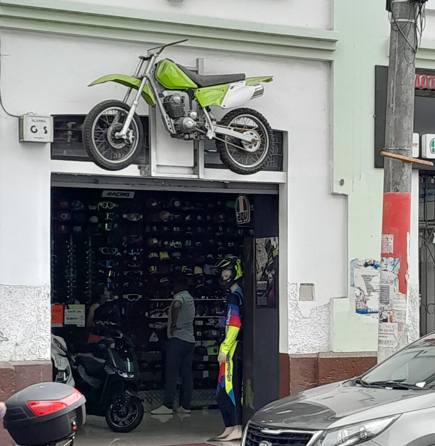 motorcycle high above store front