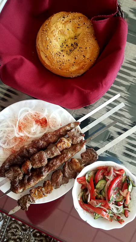 kebab, bread and salad on the table