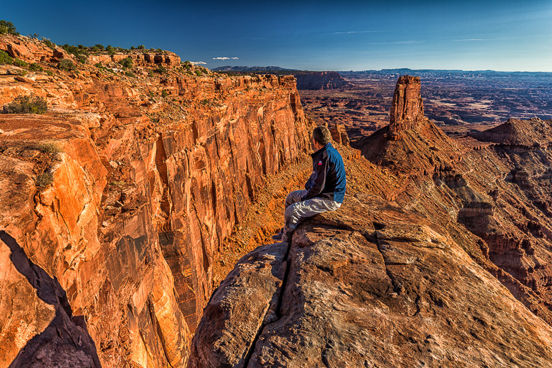 Sitting on the edge of a desert cliff