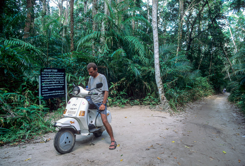 Sitting on a scooter in a forest