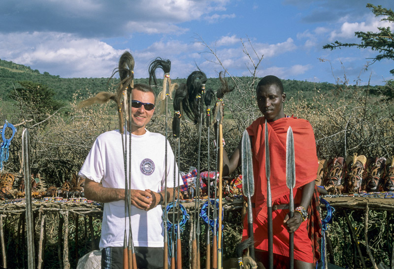 posing with a Maasai worrior