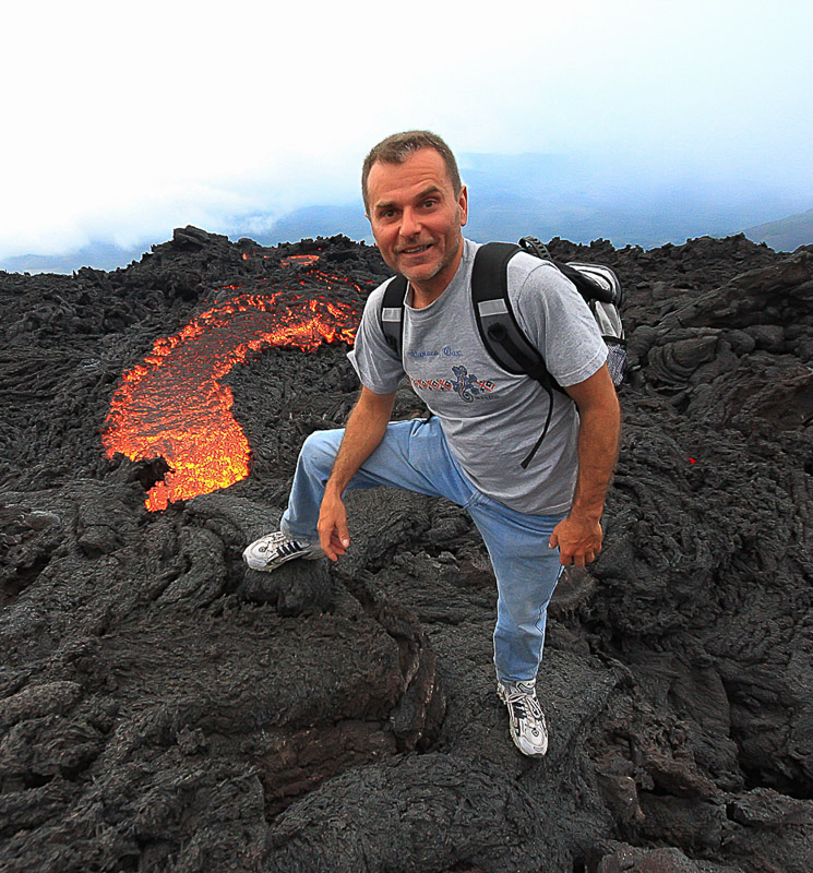 Posing next to a molten lava