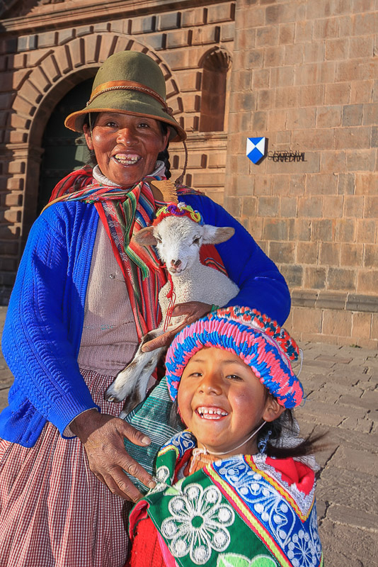 Cuzco mom and daughter in colorful dresses